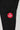 Close-up of the GB x adidas III Stripes Compression Pants showing the Red Shield logo printed on the upper leg of black performance fabric.