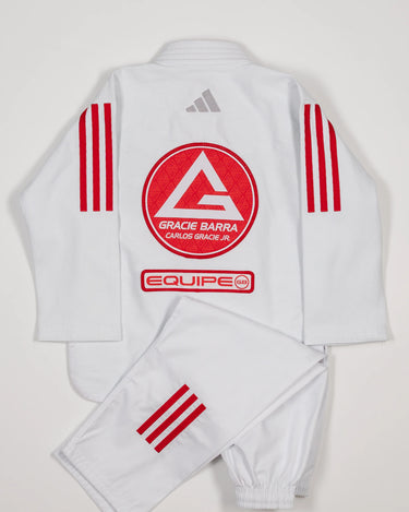 Back view of white GB x adidas III Stripes Youth Kimono with pants folded across jacket, featuring large Red Shield patch, red EQUIPE GB patch, and bold red 3-Stripes on shoulders and pant leg.