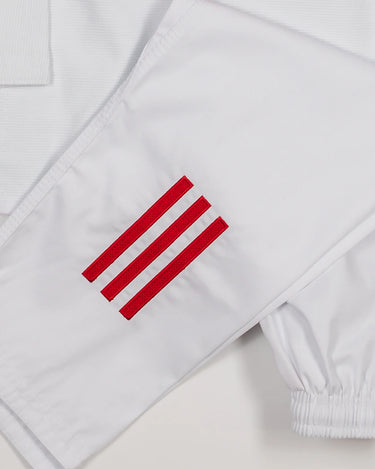 Close-up of white GB x adidas III Stripes Youth Kimono showing red 3-Stripes detail on pant leg and red EQUIPE GB patch on jacket back.