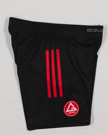 Side view of the GB x adidas III Stripes Training Shorts in black, showing red adidas triple stripes, the Red Shield logo on the leg, and “Equipe GB” branding on the waistband.
