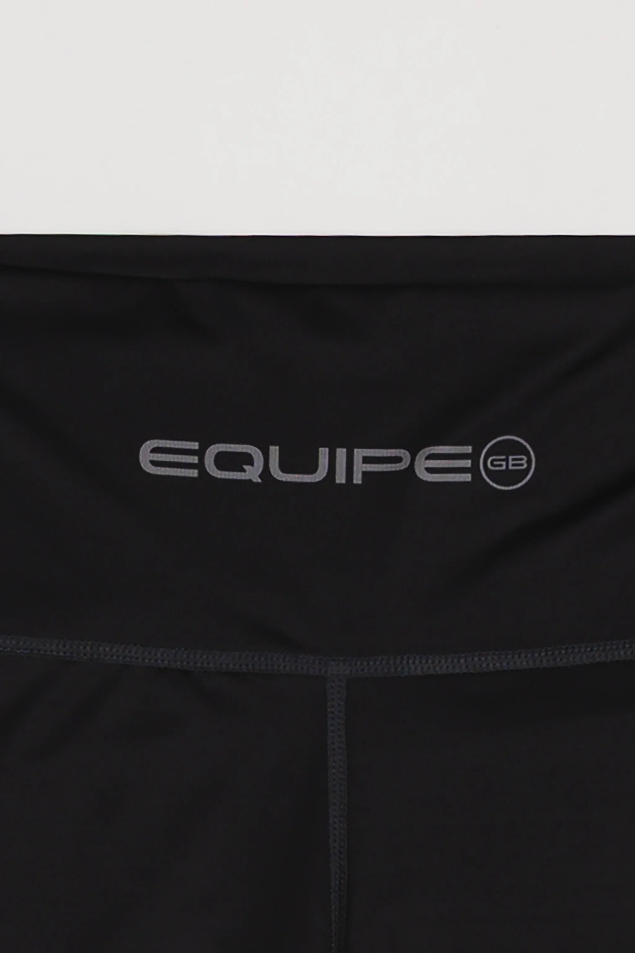 Close-up of the waistband on the GB x adidas III Stripes Women’s Compression Tights showing the “Equipe GB” graphic printed across the front.