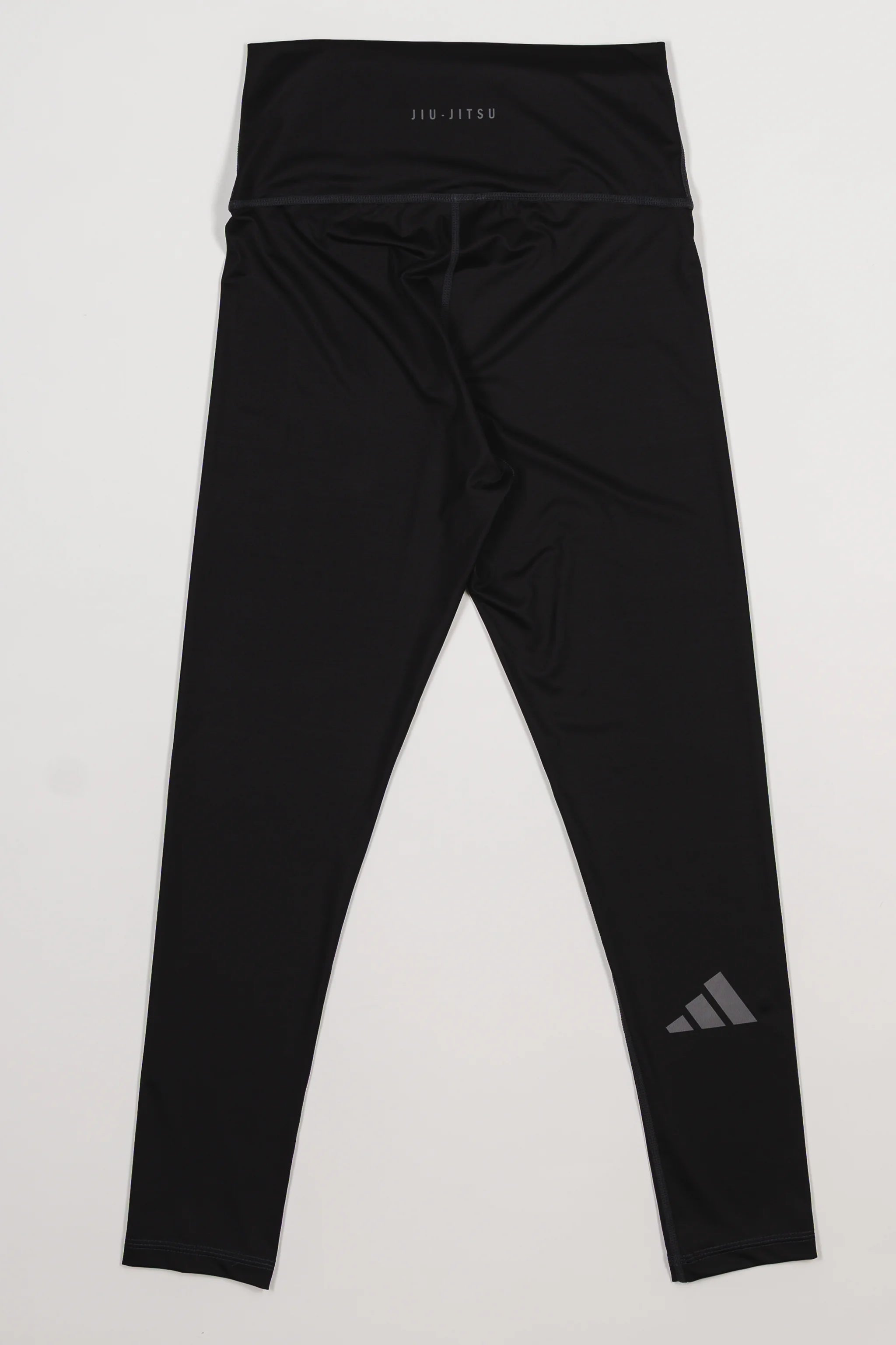 Back view of the GB x adidas III Stripes Women’s Compression Tights in black, showing the adidas logo on the lower leg and “Jiu-Jitsu” branding on the waistband.