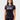 Student wearing the black III Stripes Womens Ranked Rashguard by adidas, with red three-stripe sleeves, red flatlock seams and gray stacked Gracie Barra logo