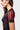 Three red adidas stripes on the black raglan sleeve of the III Stripes Womens Ranked Rashguard, with red flatlock seams and stitched cuff trim