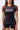 Front torso view of the brown III Stripes Womens Ranked Rashguard by adidas showing red contrast flatlock side seams and the gray stacked Gracie Barra logo