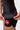 Mesh hem panel with white Jiu-Jitsu print and red contrast flatlock stitching on the brown III Stripes Womens Ranked Rashguard by adidas