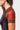 Three red adidas stripes on the brown raglan sleeve of the III Stripes Womens Ranked Rashguard, with red flatlock seams and stitched cuff trim
