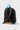 Back view of the Jiu Jitsu Kids Backpack in Black/Grey showing the cushioned padded back panel and shoulder straps with brown suede bottom panel