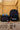 Gracie Barra Jiu-Jitsu insulated kids lunchbox with blue handle beside the matching backpack outdoors