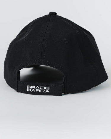 Back view of black Gracie Barra Legacy G Performance Cap with adjustable strap and white “Gracie Barra” logo embroidery on closure.