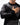 Legacy Mens Knit Sweater in black with tonal jacquard-knit geometric pattern, model with hand on chest showing Gracie Barra sleeve embroidery.