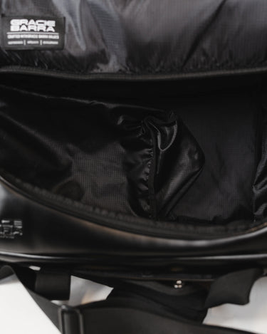 Interior view of the Legacy Travel Duffel showing the spacious main compartment with ripstop lining, zipper access, and padded strap visible at the base.