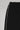 Side detail of black Legacy Windrunner pants showing the white side stripe, photographed on a light gray background.