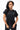 Legacy Womens Active Tee in black, front view on model with hands at the hem, crew neckline and white Legacy G chest logo.