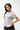 Legacy Womens Active Tee in grey, front view on model with hand on hip, crew neckline and white Legacy G chest logo.