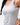 Legacy Womens Performance Racerback Tank in grey, close-up of chest showing white Legacy G logo and scoop neckline on lightweight performance fabric.