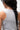 Legacy Womens Performance Racerback Tank in grey, back view close-up showing racerback design and stacked Gracie Barra wordmark at upper back.