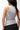 Legacy Womens Performance Racerback Tank in grey, back view on model showing racerback design and stacked Gracie Barra wordmark at upper back.