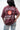 Woman seen from behind in the maroon Living Legacy Boxy Tee showing the Jiu-Jitsu, Barra Shield and Keeping the Legacy Alive back print.