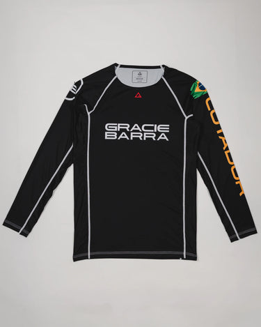 Full front view of the Lutador Longsleeve Ranked Rashguard in black, featuring the black torso, black raglan sleeves, white Gracie Barra wordmark, Brazilian flag arm patch, and gold ‘Lutador’ sleeve print.