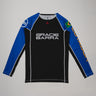 Full front view of the Lutador Longsleeve Ranked Rashguard in blue, featuring black torso, blue raglan sleeves, Gracie Barra wordmark, Brazilian flag arm patch, and gold ‘Lutador’ sleeve print.