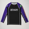 Full front view of the Lutador Longsleeve Ranked Rashguard in purple, featuring black torso, purple raglan sleeves, Gracie Barra wordmark, Brazilian flag arm patch, and gold ‘Lutador’ sleeve print.