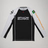 Full front view of the Lutador Longsleeve Ranked Rashguard laid flat, showing black torso, white raglan sleeves, Gracie Barra wordmark, Brazilian flag arm patch, and gold ‘Lutador’ sleeve print.