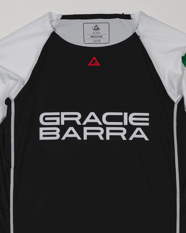 Front view of the Lutador Longsleeve Ranked Rashguard showing the black torso, white raglan sleeves, red Legacy G chest logo, and large white Gracie Barra wordmark.