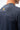 Close-up of Lutador Mens Active Longsleeve Tee in navy showing gold Legacy G logo and Jiu-Jitsu text on the upper back with shoulder seam detail.