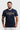 Navy Gracie Barra Lutador mens tee, front view with the gold LUTADOR chest print, Gracie Barra line above, and white Equipe GB badge below.
