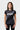 Front view of the black Gracie Barra Proximity Womens Training Tee showing the white Legacy G and stacked Gracie Barra print on micro-mesh fabric.