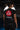 Back view of the black Gracie Barra Proximity womens training tee worn by a student, showing the red Barra Shield and white Equipe graphic on the back.