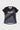 Black Gracie Barra Proximity womens training tee, front layflat, with white Gracie Barra chest print, gray diagonal panels, and a Legacy G triangle.