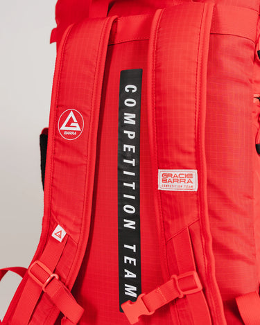 Detailed back view of Red Comp GB4 Backpack highlighting “Competition Team” straps, Gracie Barra patch, and padded back support for comfort and durability.
