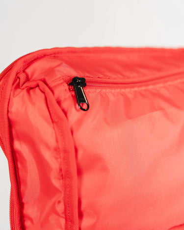 Close-up of Red GB4 Kids Backpack top compartment from Gracie Barra Red Comp Collection, showing smooth hidden zipper and durable lightweight nylon fabric.