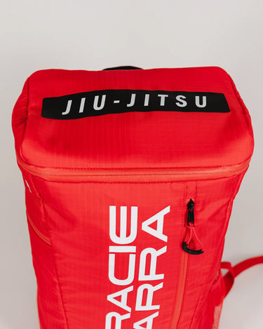 Top view of Red Comp GB4 Backpack showing black “Jiu-Jitsu” patch and vertical “Gracie Barra” logo, highlighting the clean Red Comp Collection design.