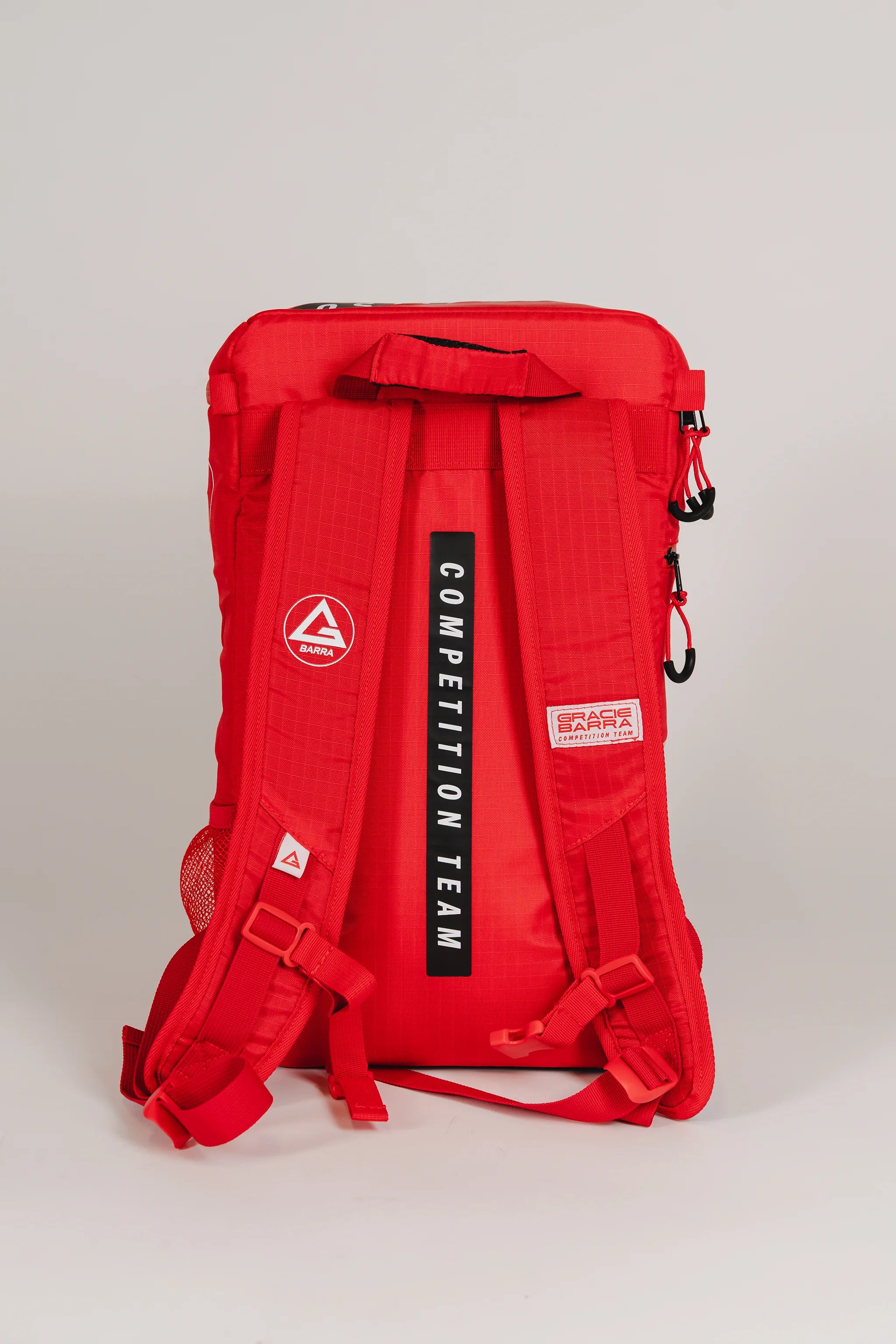 Back view of Red GB4 Kids Backpack from Gracie Barra Red Comp Collection, featuring “Competition Team” straps, GB patch detailing, and padded ergonomic design for comfort.