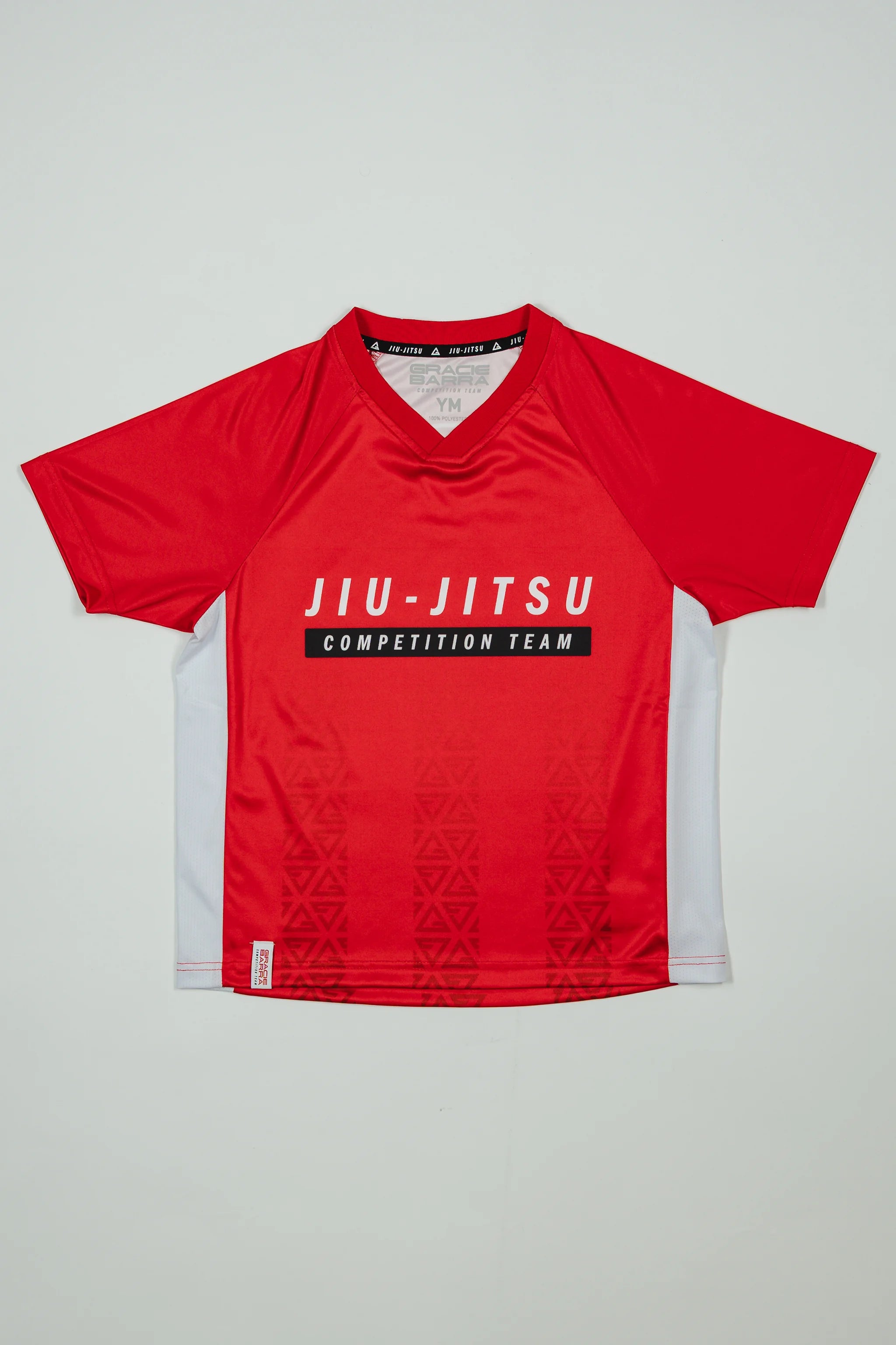 Kids’ Red Comp Team Jersey featuring the official Jiu-Jitsu Competition Team front graphic and tonal Legacy G pattern in signature GB Red on a light background.