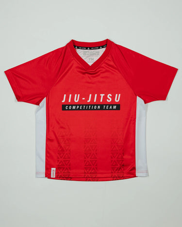 Kids’ Red Comp Team Jersey featuring the official Jiu-Jitsu Competition Team front graphic and tonal Legacy G pattern in signature GB Red on a light background.