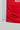Close-up of the Kids’ Red Comp Team Jersey hem highlighting the Legacy G geometric pattern and white side panel.