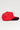 Side profile of the Red Comp Team Cap showing the structured red wool twill panels, black brim with red stitching, and black eyelets.
