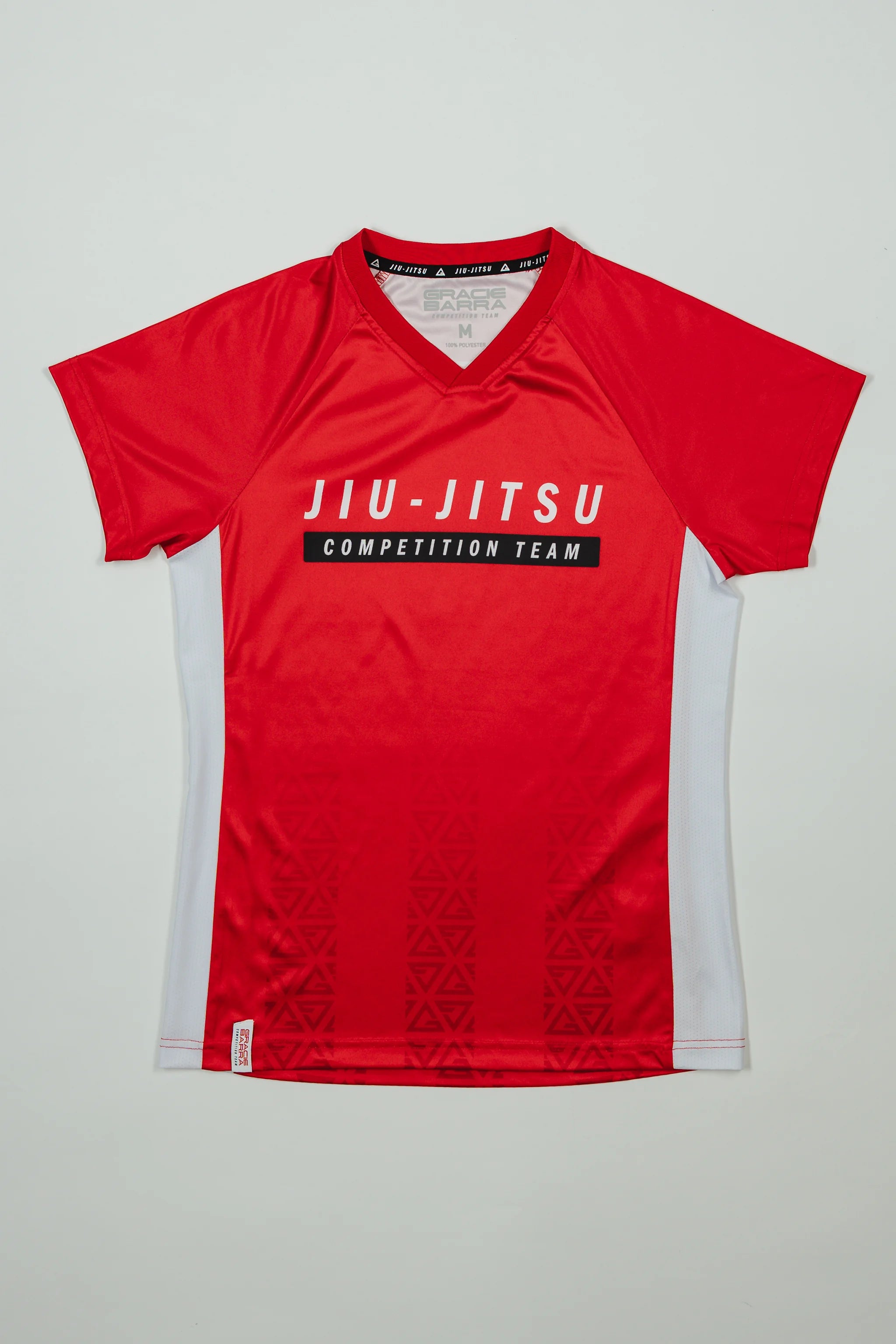 Front view of Red Comp Women’s Team Jersey featuring the official “Jiu-Jitsu Competition Team” graphic, white side panels, and tonal GB Red pattern.