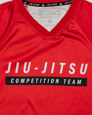 Close-up of Red Comp Women’s Team Jersey showing the official “Jiu-Jitsu Competition Team” graphic and Gracie Barra neck label on GB Red fabric.
