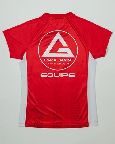 Back view of Red Comp Women’s Team Jersey featuring the Gracie Barra Red Shield, “Equipe” graphic, and tonal GB Red pattern on a light background.