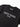 Close-up of Rio Roots Kids Tee in black showing "Gracie Barra Estd 1986" chest graphic and Stacked logo neck tag detail.