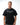 Rio Roots Mens Tee in Black — front view on model showing the Gracie Barra Estd 1986 chest graphic and relaxed oversized fit.