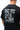 Rio Roots Mens Tee in Black — back close-up showing the archival Gracie Barra photo with Keeping the Legacy Alive and Estd 1986 graphic.