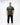 Rio Roots Mens Tee in Forest Green - full front view on model showing the Gracie Barra Estd 1986 chest graphic and relaxed oversized fit.