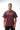 Rio Roots men's tee in mahogany, full front on-model view with tan GRACIE BARRA wordmark and white ESTD 1986 chest print.