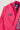 Front upper detail of pink Ripstop Lite Women’s BJJ kimono by adidas and Gracie Barra, featuring “Jiu-Jitsu” patch, Red Shield chest patch, and “Gracie Barra” embroidered lapel trim.